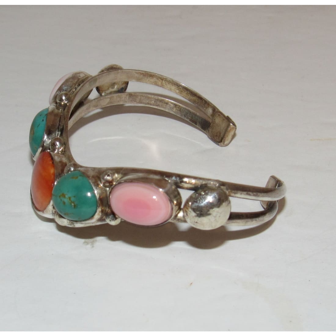 Native American Navajo turquoise spiny oyster cuff bracelet Dave Lister with pink and orange stones on silver band