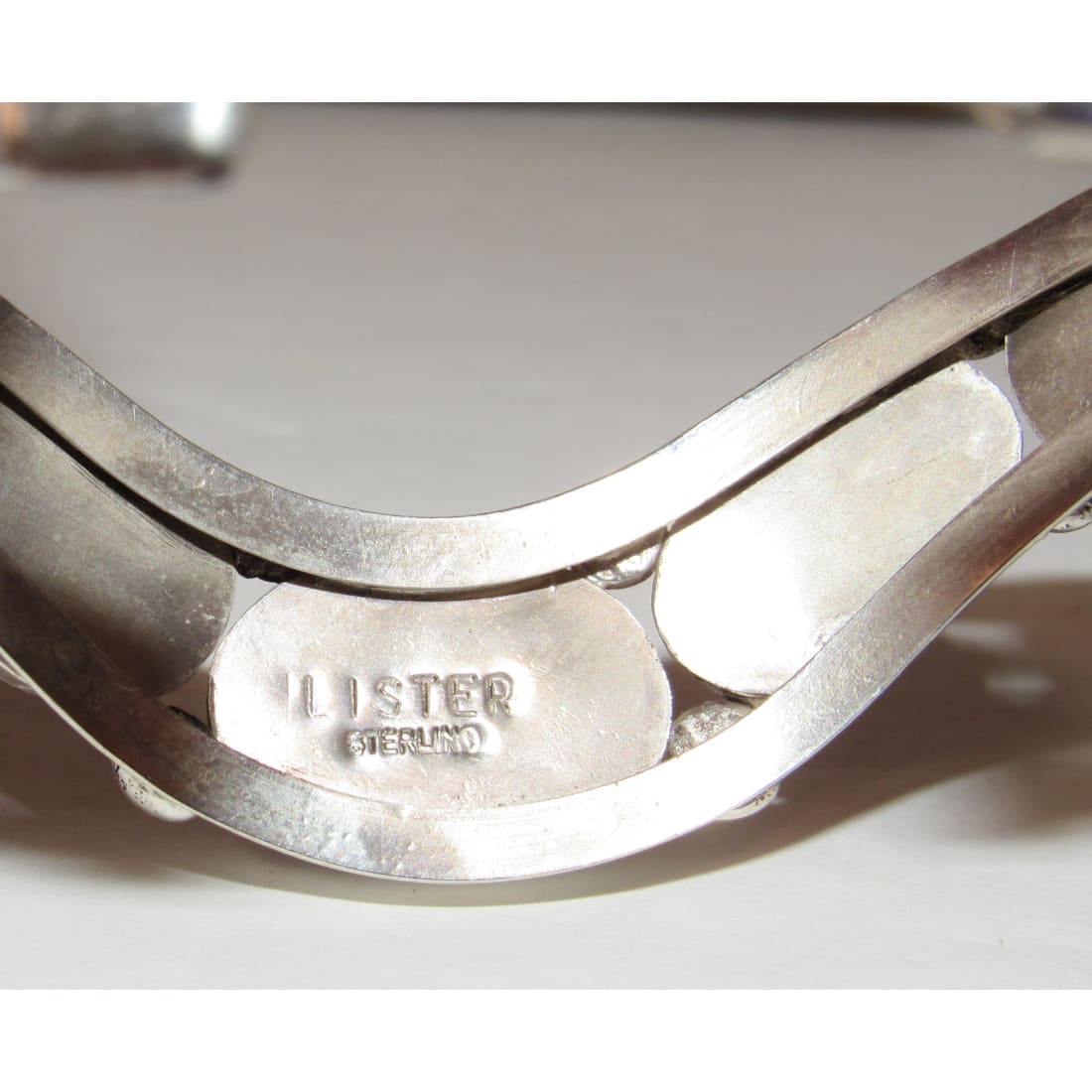 Close-up of Davida Lister Purple Spiny Bracelet sterling silver hallmark with Native American craftsmanship