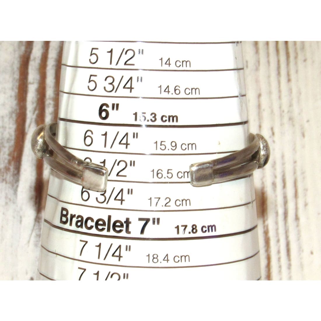 Native American Davida Lister Purple Spiny Bracelet displayed on a sizing tool showing approximately 7 inch size