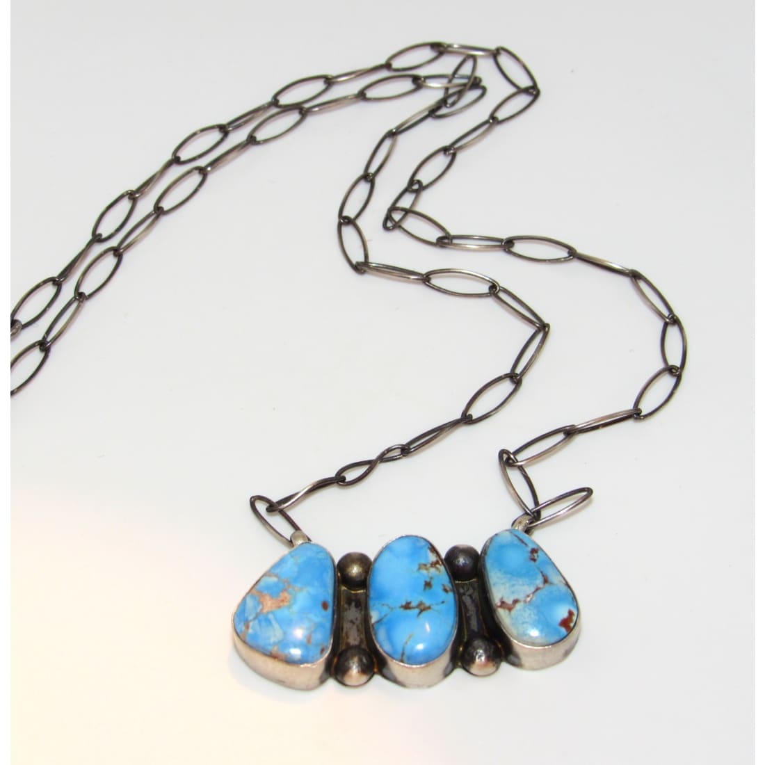 Navajo Golden Hills turquoise necklace with three vibrant turquoise stones and silver chain by The Southwestern Style Gallery