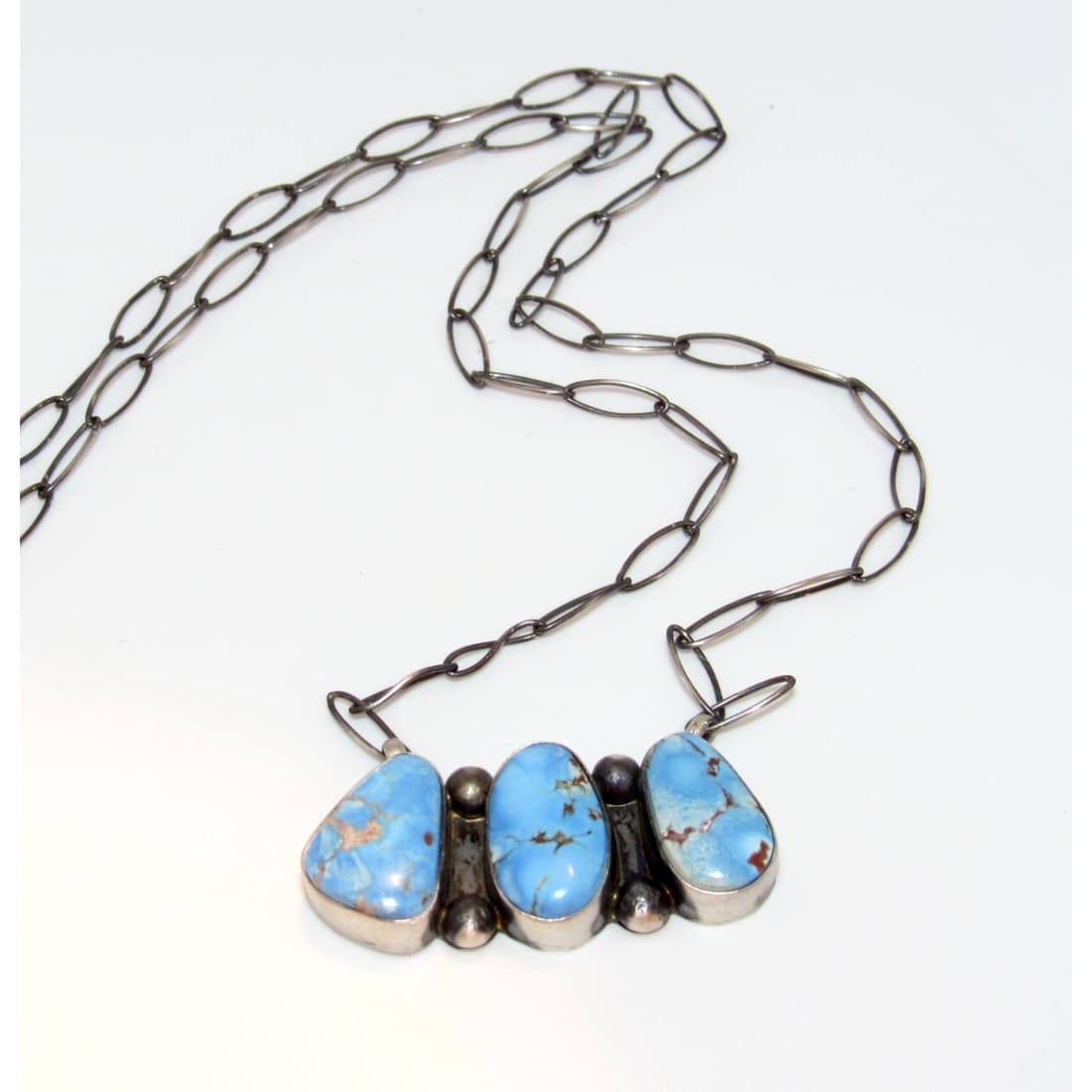 Navajo Golden Hills turquoise necklace with three blue turquoise stones and silver chain from The Southwestern Style Gallery