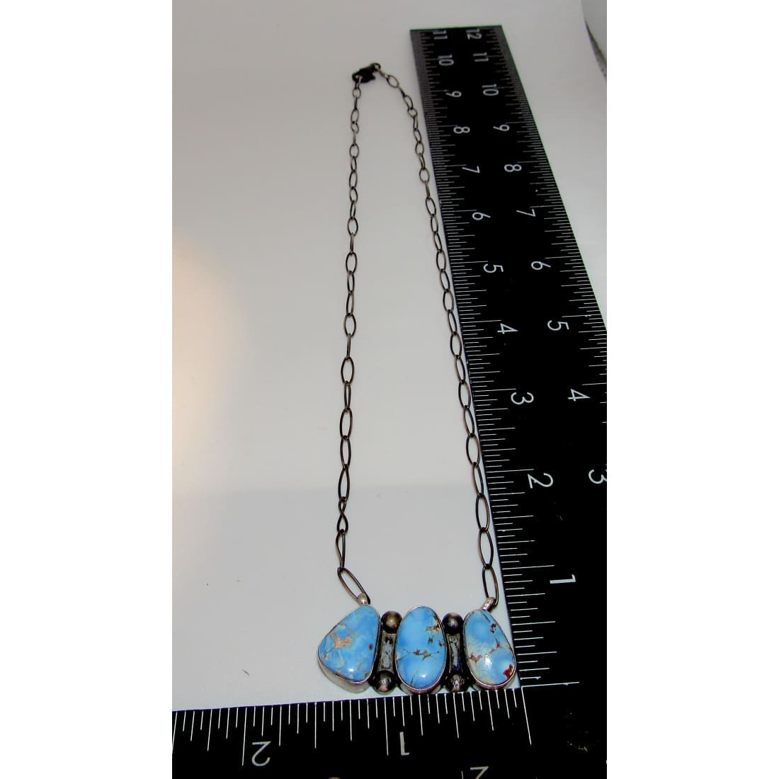 Navajo Golden Hills turquoise necklace with three blue turquoise stones on silver chain from The Southwestern Style Gallery